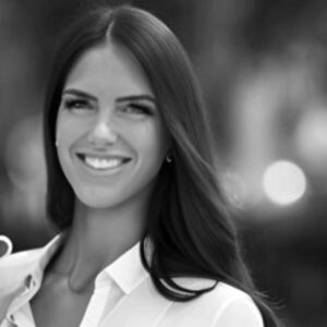 Woman with long, straight hair smiling